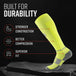 Neon yellow tall compression sock with gray heel and toe, displayed on dark surface showing durability features