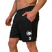 Man wearing black MudGear performance shorts with Lionhearts Fitness logo, side view showing fit and pockets